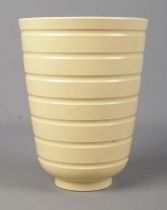 A Wedgwood pottery vase of ribbed form designed by Keith Murray. Height 18.5cm.