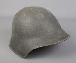 A Swiss Army M18 steel helmet.