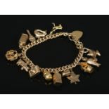 A 9ct gold charm bracelet with mostly 9ct gold charms. Gross weight 36.54g.