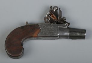 An early 19th century flintlock pocket pistol. Having pull down trigger and screw off barrel. The