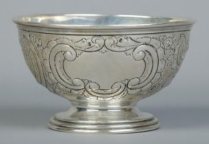 A George V silver pedestal bowl with repousse decoration. Assayed Sheffield 1911 by Walker & Hall.