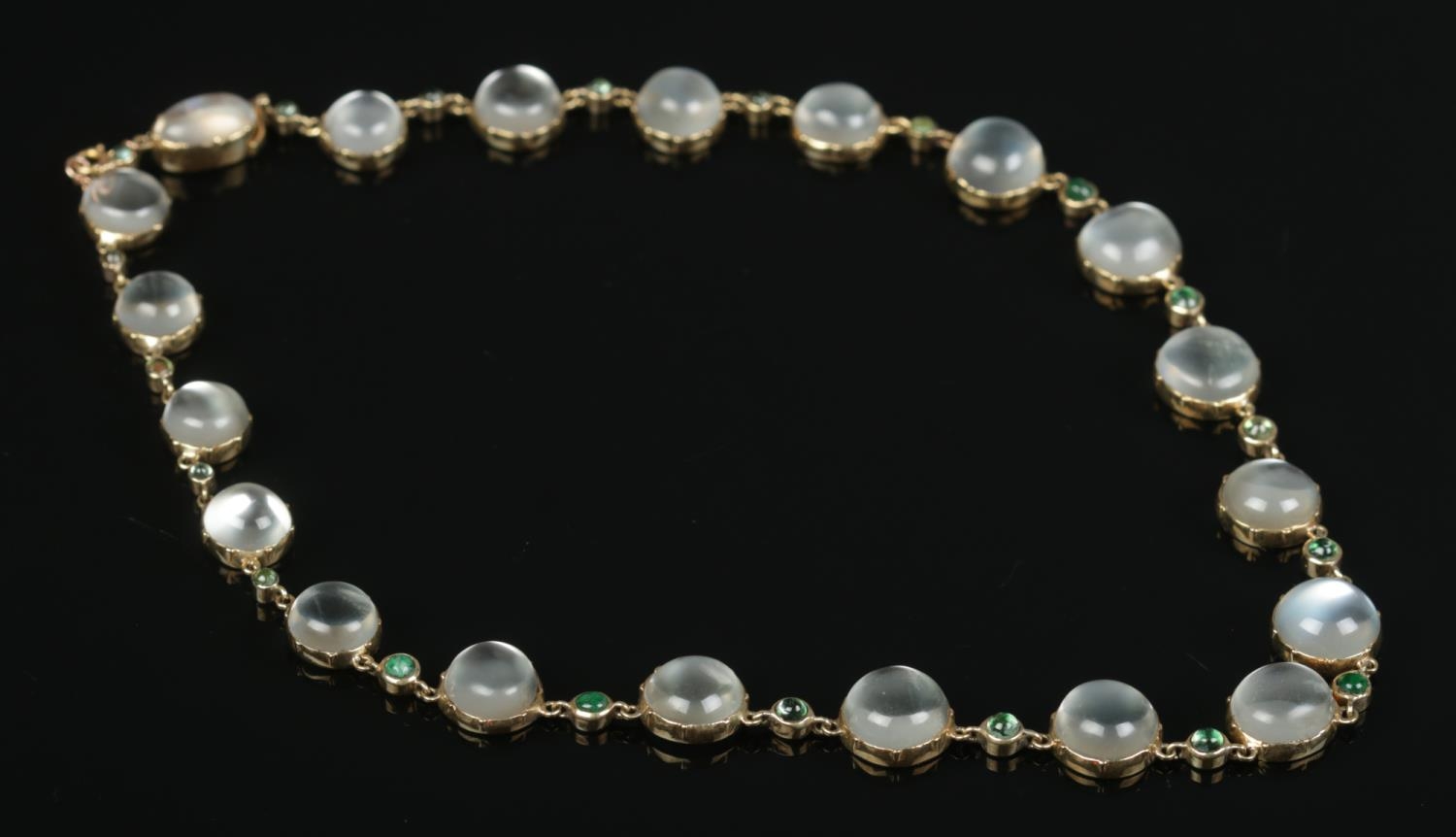 A 9ct gold moonstone and emerald coloured necklace, set with alternating cabochon stones. - Image 2 of 2