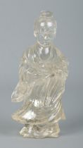 A Chinese rock crystal sculpture of Guanyin. Height 13cm. Small chips and cracks to outside.
