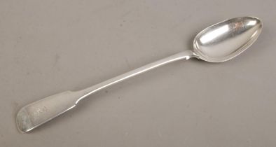 A Victorian silver basting spoon. Bearing rearing lion crest and Latin motto to terminal. Assayed