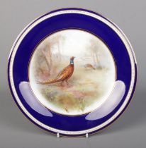 James Stinton for Grainger & Co Worcester, a porcelain plate with hand painted woodland scene and