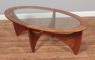 A G Plan Astro style teak coffee table with glass top. Approx. dimensions 122cm x 66cm x 42cm.