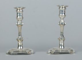 A pair of silver candlesticks with detachable nozzles. Assayed for Sheffield with date marks for