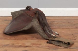 A WWI leather saddle, with adjustable stirrups.