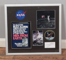 A framed Buzz Aldrin display featuring signed autograph, Men From Earth book and several colour