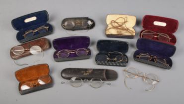 A collection of early 20th century and later spectacles mostly including cases and gold plate