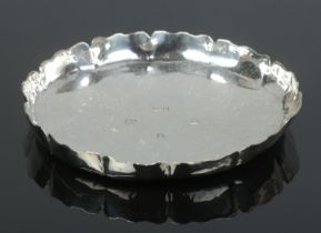 A heavy silver shallow dish with scalloped edge. Assayed London 1988 by Dorothy May Budd. Diameter
