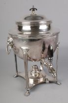 An early 20th century silver plated samovar with lionhead handles and lion paw feet. Good condition.