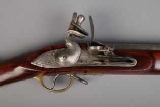 A 19th century flint lock Brown Bess musket. Stamped Tower to lock plate and stock, along with