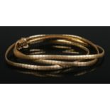 An 18ct gold three band flat link bracelet. Stamped 750 20 VR. 20.73g.