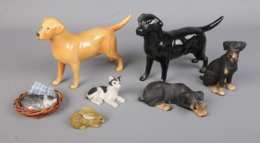 A collection of ceramic animal figures to include two Beswick Solomon of Wendover Labradors,