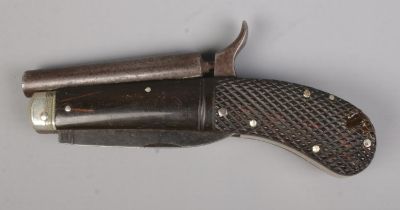 A 19th century percussion knife pistol. Having chequered grip, folding knife and pull down