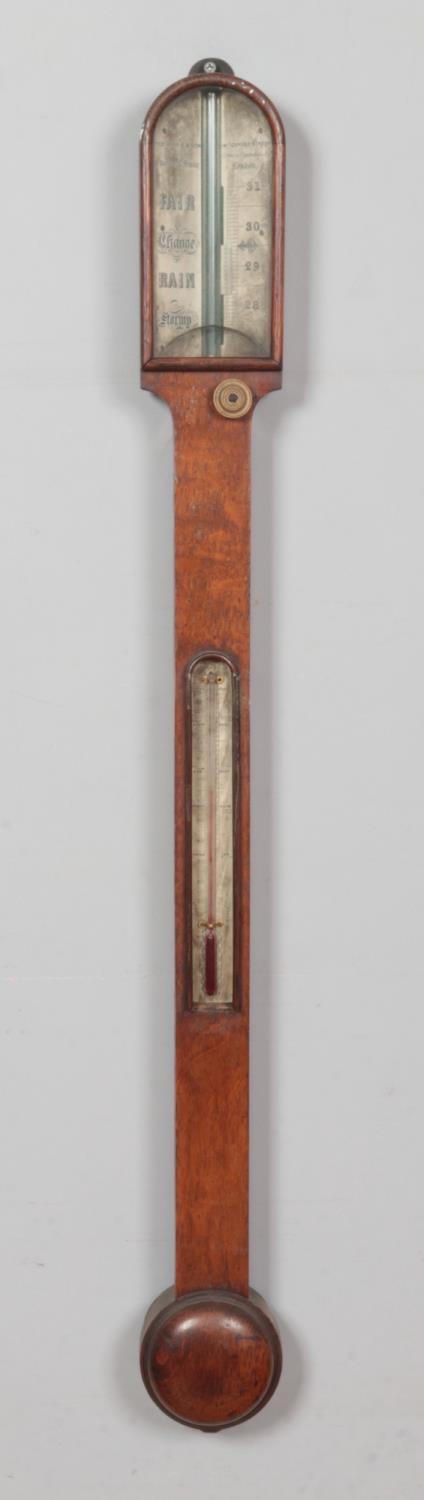 An early 19th century Thomas Harris & Son oak stick barometer. Length 92cm.