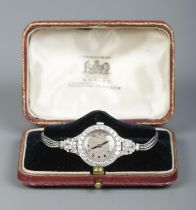 A vintage ladies platinum and diamond manual cocktail watch on 9ct white gold rope twist strap. 19.