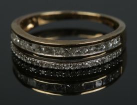 A 9ct gold and diamond half eternity ring along with Gemporia certificate of authenticity. Approx.