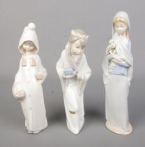 Three Lladro ceramic figures to include King Gasper and Shepard from a nativity scene. Shepard is