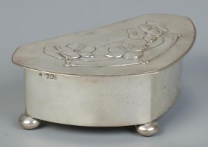 An Art Nouveau silver lidded box raised on three bun feet. Assayed London 1903. 298g. Height 6cm,