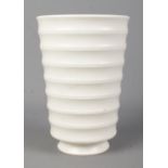 A Wedgwood pottery vase of ribbed form designed by Keith Murray. 18cm. No chips, cracks or repairs.