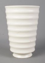 A Wedgwood pottery vase of ribbed form designed by Keith Murray. 18cm.