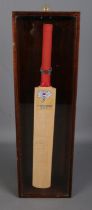 A signed miniature cricket bat display for the Yorkshire County Cricket Club.