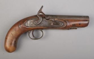 A 19th century flint lock pistol. Total length 24cm. CANNOT POST OVERSEAS. Signs of woodworm.