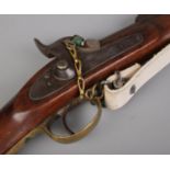 A 19th century Enfield pattern three band muzzle loading percussion rifle. The lock plate stamped