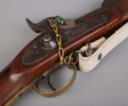 A 19th century Enfield pattern three band muzzle loading percussion rifle. The lock plate stamped