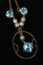 A 9ct gold Edwardian style pendant on chain featuring simulated pearls and three blue paste