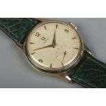 A gents 9ct gold Omega manual wristwatch. Having subsidiary seconds and baton and Arabic numeral