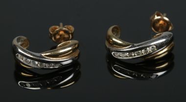 A pair of 9ct gold six stone diamond earrings. Total weight 2.6g.