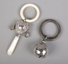 Two antique silver baby rattles/teething rings including mother of pearl example. Mother of Pearl