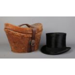 A Lincoln Bennett & Co moleskin top hat in leather box. Front to back measurement 19.5cm, side to