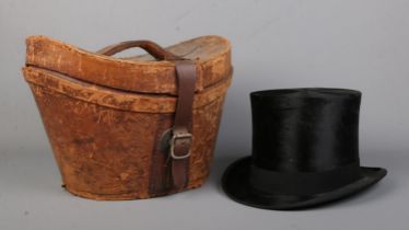 A Lincoln Bennett & Co moleskin top hat in leather box. Front to back measurement 19.5cm, side to