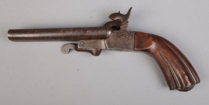 A 19th century double barrel percussion pistol. Length 24.5cm. CANNOT POST OVERSEAS.