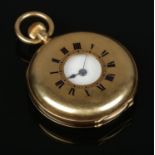 An 18ct gold demi hunter fob watch. Engraved with monogram to back of case. 53.11g gross weight.