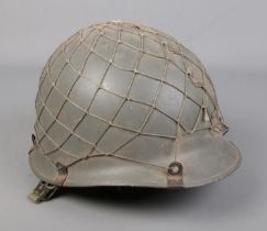A Danish M48/M1 style civil defence helmet. Having crowned CF stamp to interior.