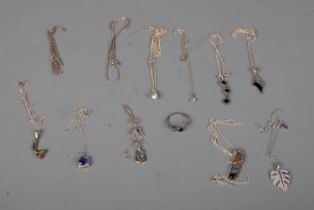 A quantity of silver mostly comprising of various silver chains and pendants with one ring. 42.4g