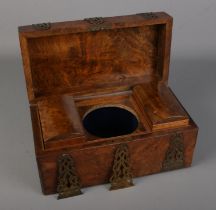 A Victorian rectangular burr walnut tea caddy with brass mounts and escutcheons. No central bowl and