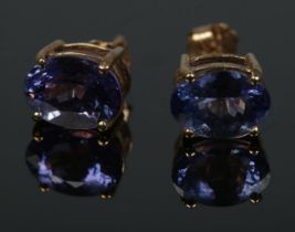 A pair of 9ct gold oval cut tanzanite stud earrings. Total weight 1.4g.
