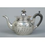 A small Victorian silver bachelor teapot. With ebonised final and handle. Assayed Sheffield 1896