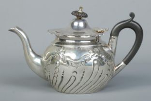 A small Victorian silver bachelor teapot. With ebonised final and handle. Assayed Sheffield 1896