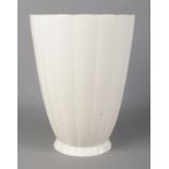 A Wedgwood pottery vase of fluted form designed by Keith Murray. Height 23cm. Small chip to foot