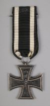 An Imperial German Military First World War iron cross medal with ribbon.