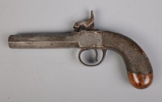 A 19th century percussion cap pistol with octagonal screw off barrel. Length 18cm. CANNOT POST