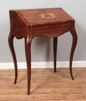 A French rosewood ladies writing desk/bureau. Having marquetry inlaid decoration and fitted