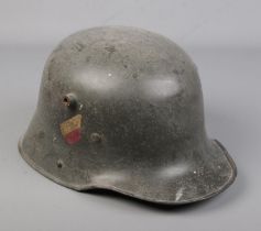 A German military M16 Stahlhelm, steel helmet, having painted decals.